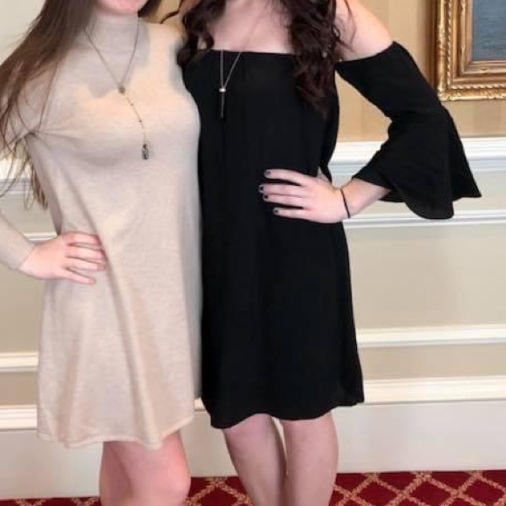 Black off the shoulder flowy dress from Dynamite